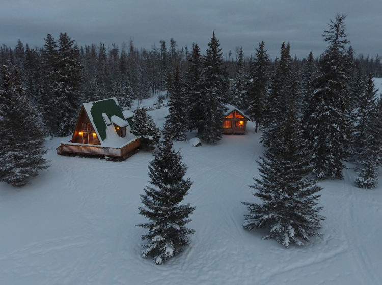 fireplaces inside cozy cabins light up two cabins just before dark
