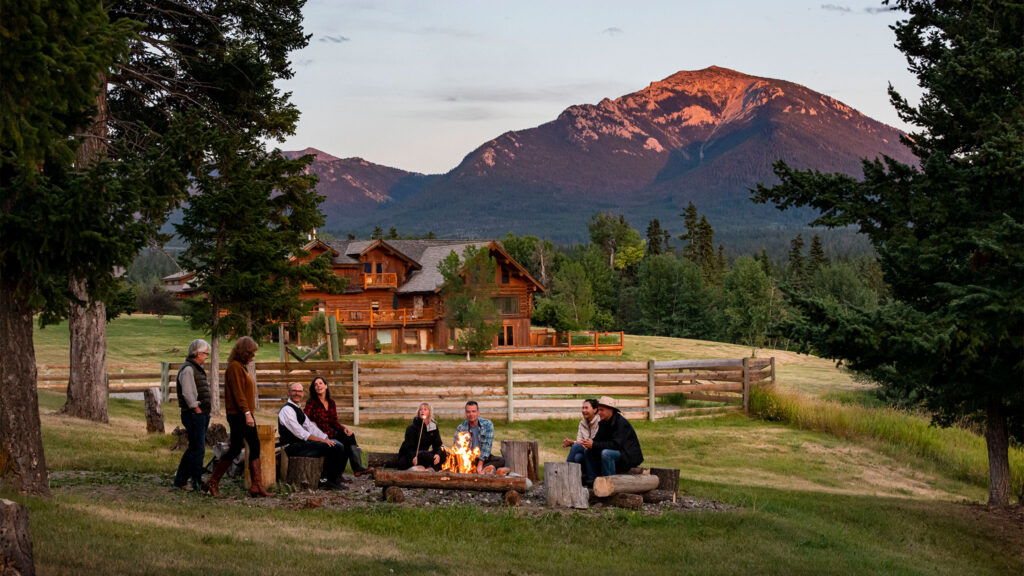 Family and friends around a campfire.